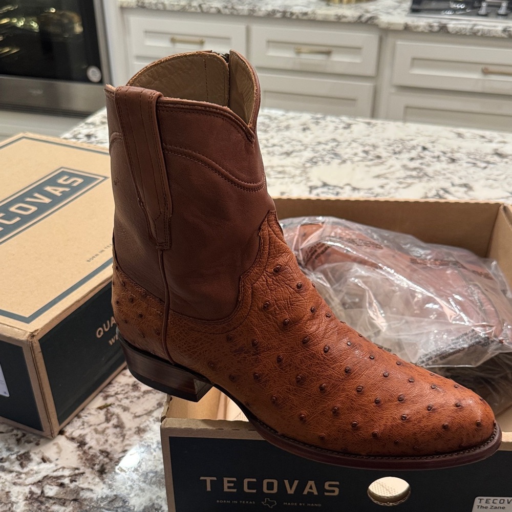 Deep leather new smell still. Worn twice.